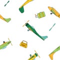 Seamless pattern with green and yellow vintage planes, travel bags and propellers in cartoon style on white background Royalty Free Stock Photo