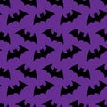 Halloween flying bat. Halloween purple seamless pattern wallpaper background. silhouette of bats. Seamless pattern. Hallowe Royalty Free Stock Photo