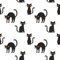 Seamless pattern with a Halloween black cat with yellow eyes. Flat cartoon cat sits, stands and arched its back. An angry, Royalty Free Stock Photo