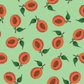 Seamless pattern with halves of peaches, apricots with pits on a green background. Watercolor illustration. For printing on