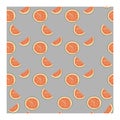 Seamless pattern with halves, slices of pink citrus fruit on a blue background. Royalty Free Stock Photo