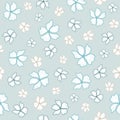 Seamless pattern with hand drawn blue and beige doodle flowers on a light blue background