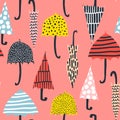 Seamless pattern with hand drawn colorful umbrellas. Childish texture. Great for fabric, textile Vector Illustration