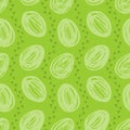 Seamless pattern with hand drawn eggs and chicken footprint isolated on green background. Royalty Free Stock Photo