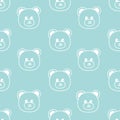 Seamless pattern with hand drawn face of teddy bear on blue background in childrens naive style