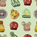 Seamless pattern with hand drawn knitted hats and berets. Colored elements on green background