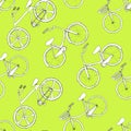 Seamless pattern with hand drawn outline bicycles. Diagonally disposed white wheels on green background. Sports design