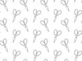 Seamless pattern from hand-drawn scissors black outline decorated with stripes on a white background for household, cutting, garde