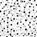 Seamless pattern with hand painted with ink splashes, spots, drops on a white background. Royalty Free Stock Photo
