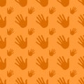 Seamless pattern handprints, isolated on orange background Royalty Free Stock Photo