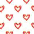 Seamless pattern with heart shaped donuts. Royalty Free Stock Photo