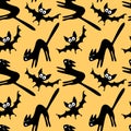 Seamless pattern with a hissing angry black witch cat and bats. Happy Halloween. Textured background for greeting card, invitation Royalty Free Stock Photo