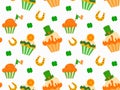 Seamless pattern with horseshoe, shamrock and cupcakes for St. Patrick's Day on a white background. Vector Royalty Free Stock Photo