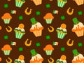 Seamless pattern with horseshoe, shamrock and cupcakes for St. Patrick's Day on a brown background. Vector. Royalty Free Stock Photo