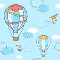 Seamless pattern with hot air balloons, paper planes and clouds Royalty Free Stock Photo