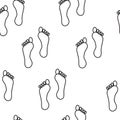 Seamless pattern. Human foot on a white background. The sketch drawn with a brush
