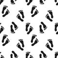 Seamless pattern of human footprints. Black and white simple design. Print, background, wallpaper