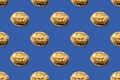 Seamless pattern from isolated images of walnut on a blue background. Oil paint technique