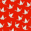 Seamless pattern with Japanese origami cranes on red background