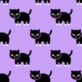 Seamless pattern. Kitten on a purple background.