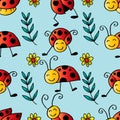 Seamless pattern with ladybugs and flowers. Royalty Free Stock Photo