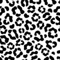 The seamless pattern of large black and white spots imitates the skin of a leopard