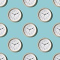 Seamless pattern of a large wall clock on a blue background Royalty Free Stock Photo