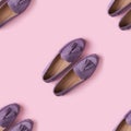 Seamless pattern of lilac suede mocassin shoes over pink background