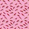 Seamless pattern made of red chili or chilli on pink background. Minimal food pattern. Red hot chilli seamless peppers pattern. Royalty Free Stock Photo