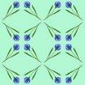 Seamless pattern made of tiny blue flowers on a pale green background. Royalty Free Stock Photo
