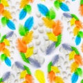 Seamless pattern made of white chicken eggs with colored ostrich feathers on a white background Royalty Free Stock Photo