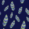 Seamless pattern of magical beautiful bird feathers on blue background. hand-drawn. Fashion pattern for clothes, T-shirt design