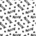 Seamless pattern with meow lettering and paws Royalty Free Stock Photo