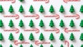 Seamless Pattern of Miniature Christmas Trees and Candy Cane Arrows Royalty Free Stock Photo