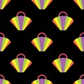 Seamless pattern with a multicolored beach bag on a black background.Bag in the form of a fan.Summer bright design for textiles. Royalty Free Stock Photo