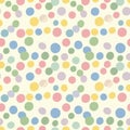 A seamless pattern of multicolored circles on a light beige background. The circles vary in size Royalty Free Stock Photo