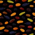 Seamless pattern with multicolored raisins on black background