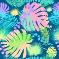 seamless pattern with multicolored tropical leaves with a dark blue background Royalty Free Stock Photo