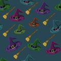 Seamless pattern with multicolored wizard`s hats and flying broomsticks on dark blue background. Halloween print. Magician design. Royalty Free Stock Photo