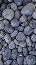 Seamless pattern of natural grey river pebbles for background texture Royalty Free Stock Photo