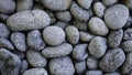 Seamless pattern of natural grey river pebbles for background texture Royalty Free Stock Photo
