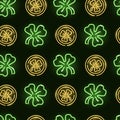 Seamless pattern with neon icons of green clover and golden coins on dark background. Saint Patrick' Day, good luck Royalty Free Stock Photo