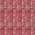 Seamless pattern with old broken red briks in vertical surface