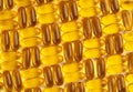 Seamless pattern of omega 3 capsules on a white background.