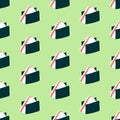 Seamless pattern with onigiri on a green background