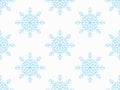 Seamless pattern with openwork blue snowflakes on white. Vector for textile, wrapping paper, winter Royalty Free Stock Photo
