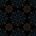 Seamless pattern of orange and blue hearts flowers on a dark background. Print with hearts in kaleidoscopic ornamental style Royalty Free Stock Photo