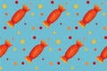 Seamless pattern with orange candies with dots on blue board. Halloween illustration. Trendy hand drawn design