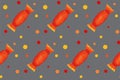 Seamless pattern with orange candies with dots on yellow board. Halloween illustration. Trendy hand drawn design