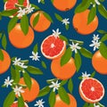 Seamless pattern orange fruits with flowers and leaves on blue background. Grapefruit vector